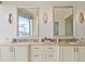 Double vanity bathroom with two sinks and large mirrors at 3376 Peachtree Ne Rd # 47A, Atlanta, GA 30326