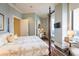 Spacious bedroom with a four-poster bed and city views at 3376 Peachtree Ne Rd # 47A, Atlanta, GA 30326