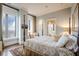 Elegant bedroom with four-poster bed and city view at 3376 Peachtree Ne Rd # 47A, Atlanta, GA 30326