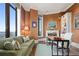 Home office with built-in shelving, fireplace, and city views at 3376 Peachtree Ne Rd # 47A, Atlanta, GA 30326