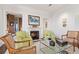 Cozy living room features a fireplace and stylish armchairs at 3376 Peachtree Ne Rd # 47A, Atlanta, GA 30326