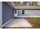 Private back patio with gray siding and landscaping at 5359 Megan Rd, Stone Mountain, GA 30088