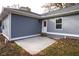 Private back patio with gray siding and landscaping at 5359 Megan Rd, Stone Mountain, GA 30088