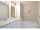 Bathroom with double vanity and neutral tile at 5359 Megan Rd, Stone Mountain, GA 30088