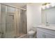 Modern bathroom with walk-in shower and white vanity at 5359 Megan Rd, Stone Mountain, GA 30088
