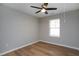 Bright bedroom with hardwood floors and window with blinds at 5359 Megan Rd, Stone Mountain, GA 30088