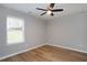 Spacious bedroom with hardwood floors and large window at 5359 Megan Rd, Stone Mountain, GA 30088