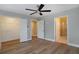 Bedroom with hardwood floors, ceiling fan, and en-suite bathroom at 5359 Megan Rd, Stone Mountain, GA 30088