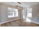 Bright dining room with hardwood floors and chandelier at 5359 Megan Rd, Stone Mountain, GA 30088