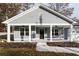 Gray house with white columns, front porch, and a two-car garage at 5359 Megan Rd, Stone Mountain, GA 30088