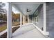 Inviting front porch with ceiling fan and view of street at 5359 Megan Rd, Stone Mountain, GA 30088