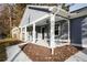 Front porch with white columns and ceiling fan at 5359 Megan Rd, Stone Mountain, GA 30088