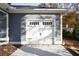 White garage door with black hardware at 5359 Megan Rd, Stone Mountain, GA 30088