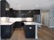 Modern kitchen with stainless steel appliances and island at 5359 Megan Rd, Stone Mountain, GA 30088