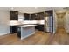 Modern kitchen with stainless steel appliances and island at 5359 Megan Rd, Stone Mountain, GA 30088