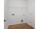 Laundry room with shelving and vinyl flooring at 5359 Megan Rd, Stone Mountain, GA 30088
