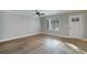 Spacious living room with hardwood floors and ceiling fan at 5359 Megan Rd, Stone Mountain, GA 30088