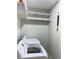 Bright laundry room with washer, dryer, and ample shelving at 3597 Mount Vernon Dr, Atlanta, GA 30344