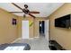 Bright bedroom with ceiling fan, double bed, and access to hallway at 6900 Roswell Rd # N9, Atlanta, GA 30328