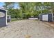 Large backyard with concrete patio and sheds at 3665 Sharon Dr, Powder Springs, GA 30127