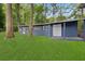 Spacious backyard with shed and mature trees at 3665 Sharon Dr, Powder Springs, GA 30127