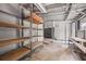 Unfinished basement with shelving and workbench at 3665 Sharon Dr, Powder Springs, GA 30127