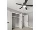 Bedroom with ceiling fan and double closets at 3665 Sharon Dr, Powder Springs, GA 30127