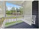 Relaxing porch swing on a covered front porch overlooking the backyard at 3665 Sharon Dr, Powder Springs, GA 30127