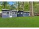 Two attached guest houses with green lawn at 3665 Sharon Dr, Powder Springs, GA 30127