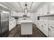 Modern kitchen with white cabinets and quartz countertops at 3665 Sharon Dr, Powder Springs, GA 30127