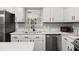 Modern kitchen with quartz countertops and a farmhouse sink at 3665 Sharon Dr, Powder Springs, GA 30127