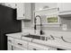 Kitchen sink and faucet with quartz countertop at 3665 Sharon Dr, Powder Springs, GA 30127