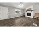 Bright living room with fireplace and wood-look tile floors at 3665 Sharon Dr, Powder Springs, GA 30127