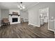 Spacious living room with fireplace, wood-look floors, and neutral color scheme at 3665 Sharon Dr, Powder Springs, GA 30127