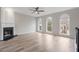 Living area with hardwood floors, fireplace and large windows at 4830 Payson Se Pl # 29, Atlanta, GA 30339