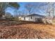 Spacious backyard with mature trees and wooden fence at 6856 Womack Ct, Peachtree Corners, GA 30360