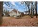 View of house from backyard with trampoline and shed at 184 Silverleaf Ln, Dallas, GA 30157