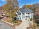 Two-story house with gray siding, white trim, balcony, and a two-car garage at 589 Lantern Wood Dr, Scottdale, GA 30079