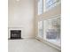 Living room with fireplace and wall of windows at 589 Lantern Wood Dr, Scottdale, GA 30079