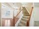 Elegant staircase with hardwood and carpet at 589 Lantern Wood Dr, Scottdale, GA 30079