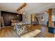 Farmhouse-style dining room with a dark accent wall and rustic wooden table at 1481 Estes Rd, Rutledge, GA 30663