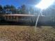 Ranch home with a large front porch and wooded backyard at 1481 Estes Rd, Rutledge, GA 30663