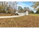 Ranch home with attached garage and a large yard at 504 Leguin Mill Rd, Locust Grove, GA 30248