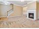 Spacious living room with fireplace and neutral carpeting at 6374 Rockaway Rd, Atlanta, GA 30349