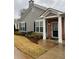 Gray siding house with brick accents, attached garage, and manicured landscaping at 244 Camry Cir, Dallas, GA 30157