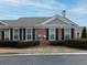 Gray siding house with brick accents, attached garage, and manicured landscaping at 244 Camry Cir, Dallas, GA 30157