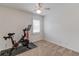 Simple bedroom with Peloton bike and large window at 4602 Hancock Way, Lilburn, GA 30047