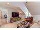 Cozy bonus room featuring a media center and comfortable armchairs at 4602 Hancock Way, Lilburn, GA 30047