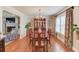 Elegant dining room with hardwood floors, chandelier, and large oval table at 4602 Hancock Way, Lilburn, GA 30047