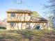 Well-maintained exterior with a large backyard at 608 Woodknoll Ct, Jonesboro, GA 30238